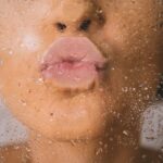 woman in water with water droplets