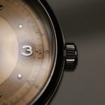 a close up of a watch on a table