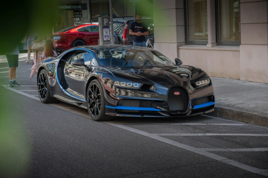blue and black porsche 911 parked on parking lot