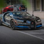 blue and black porsche 911 parked on parking lot