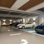 Modern indoor parking garage with parked cars.