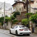 a white car parked on the side of the road