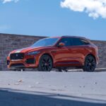 orange bmw m 3 coupe on gray concrete road during daytime
